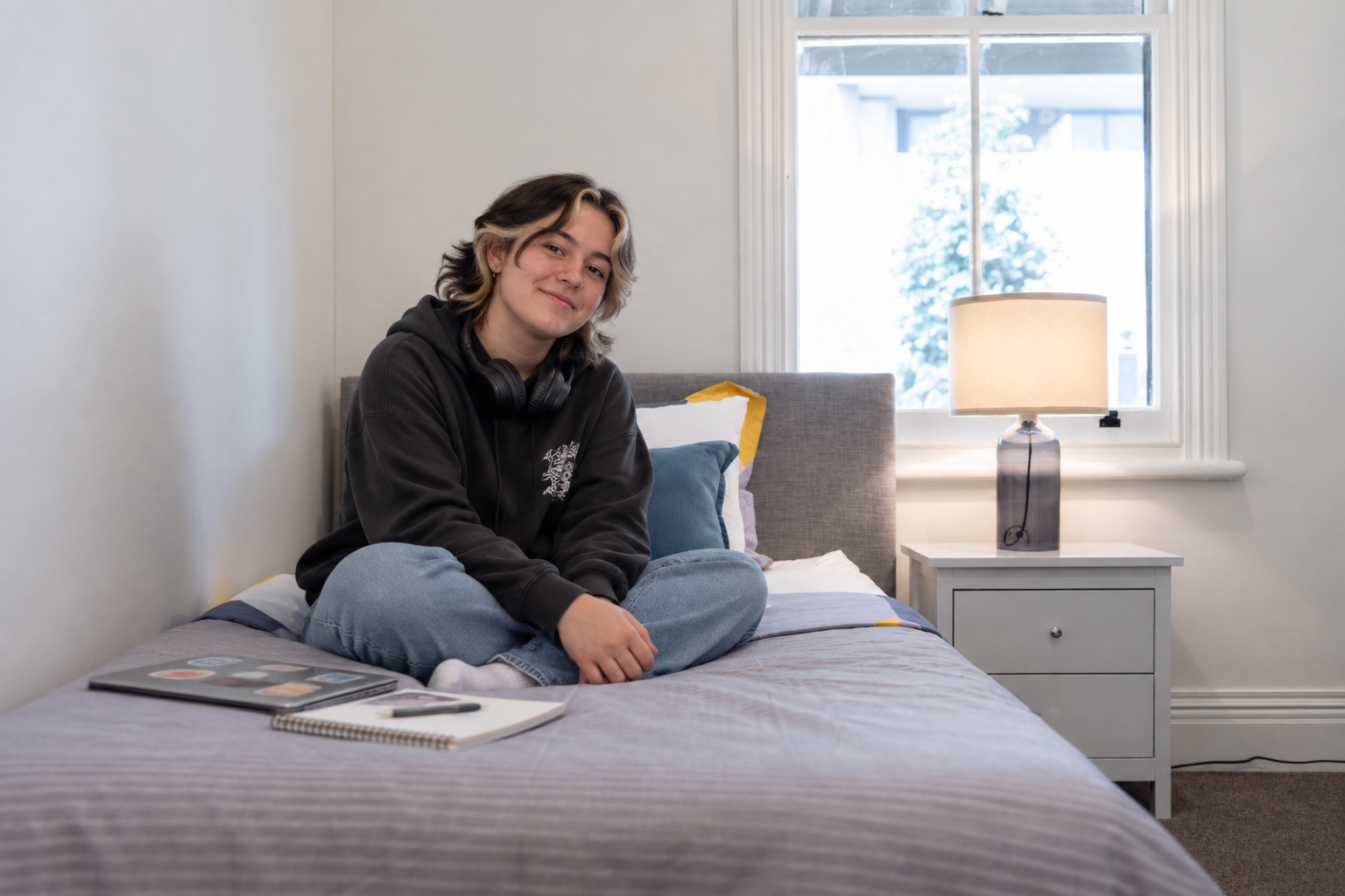 Haven House Granville: Studying Towards a Brighter Future Young person studying on her bed at Haven House Granville